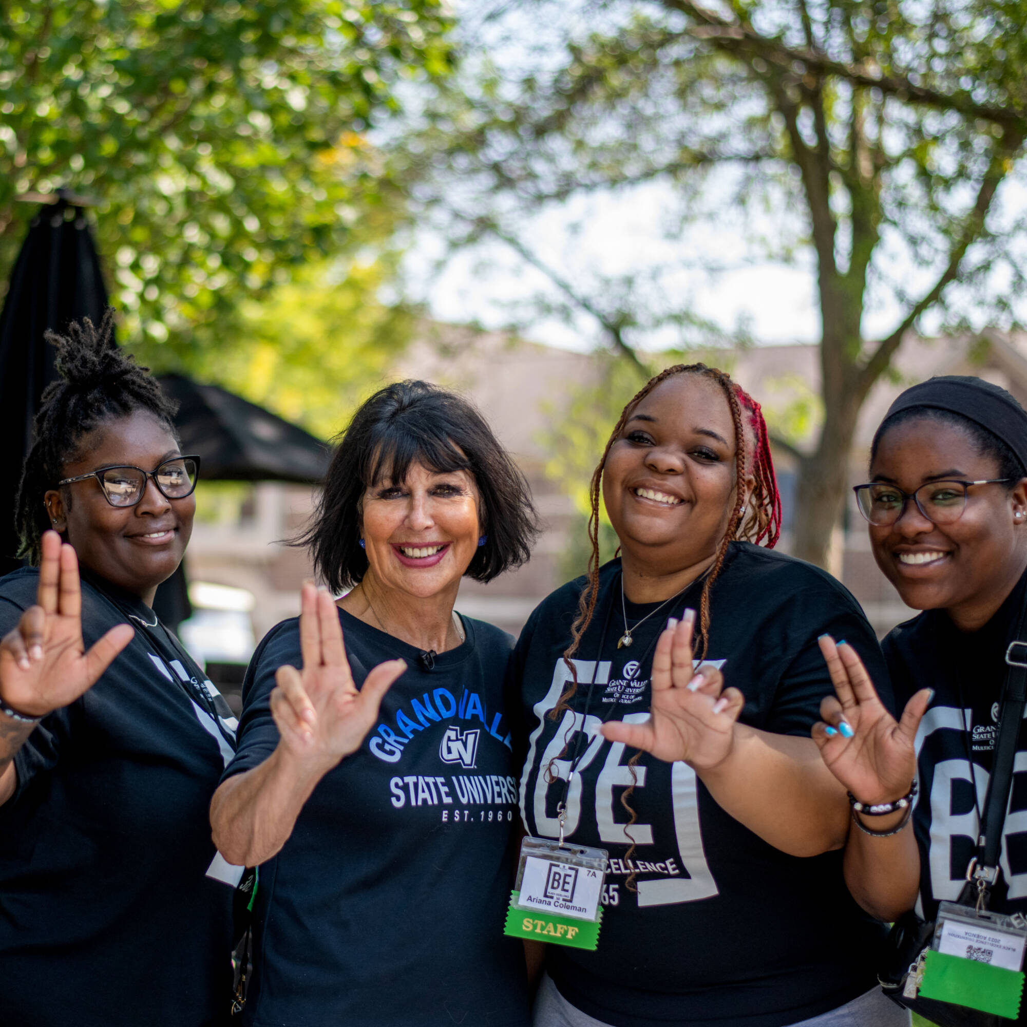 Students posing with President Mantella for the Black Excellence Affinity Orientation move in